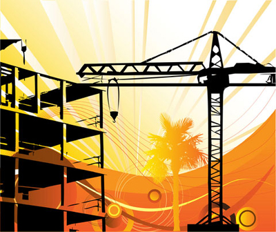 crane positioned near building at construction site